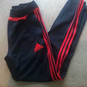 Red and blue adidas pants